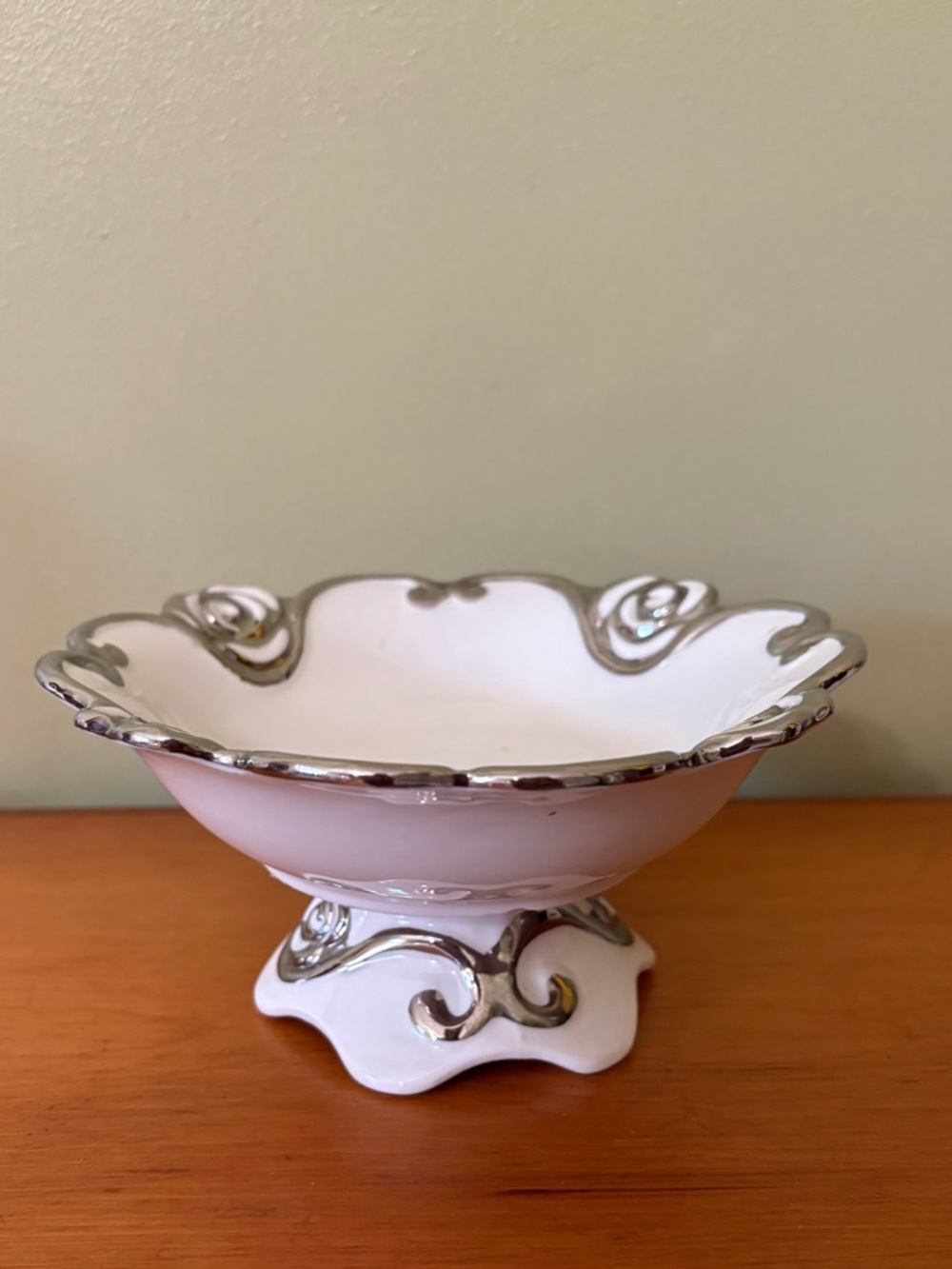 White Ceramic Scalloped Pedestal Bowl with Silver Trim Debora Carlucci